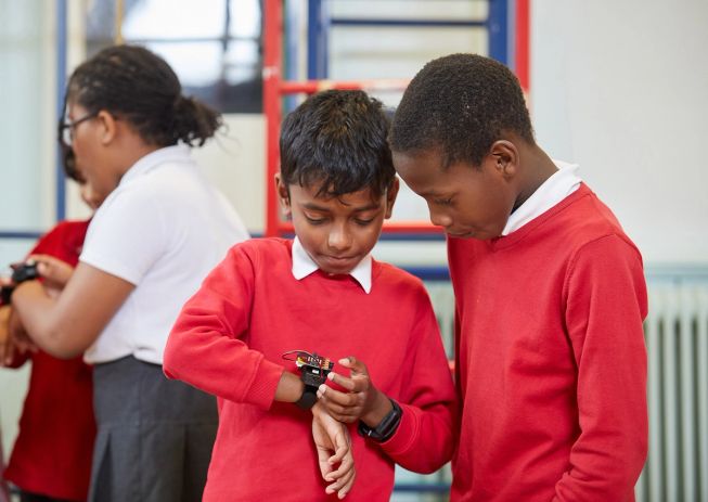 Pupils wearing the micro:bit on their wrist, using it to log data