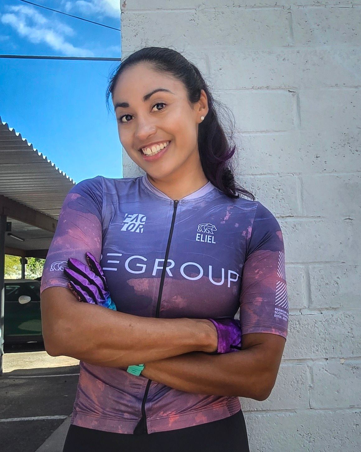 Adriana, one of our ambassadors, smiling in team kit