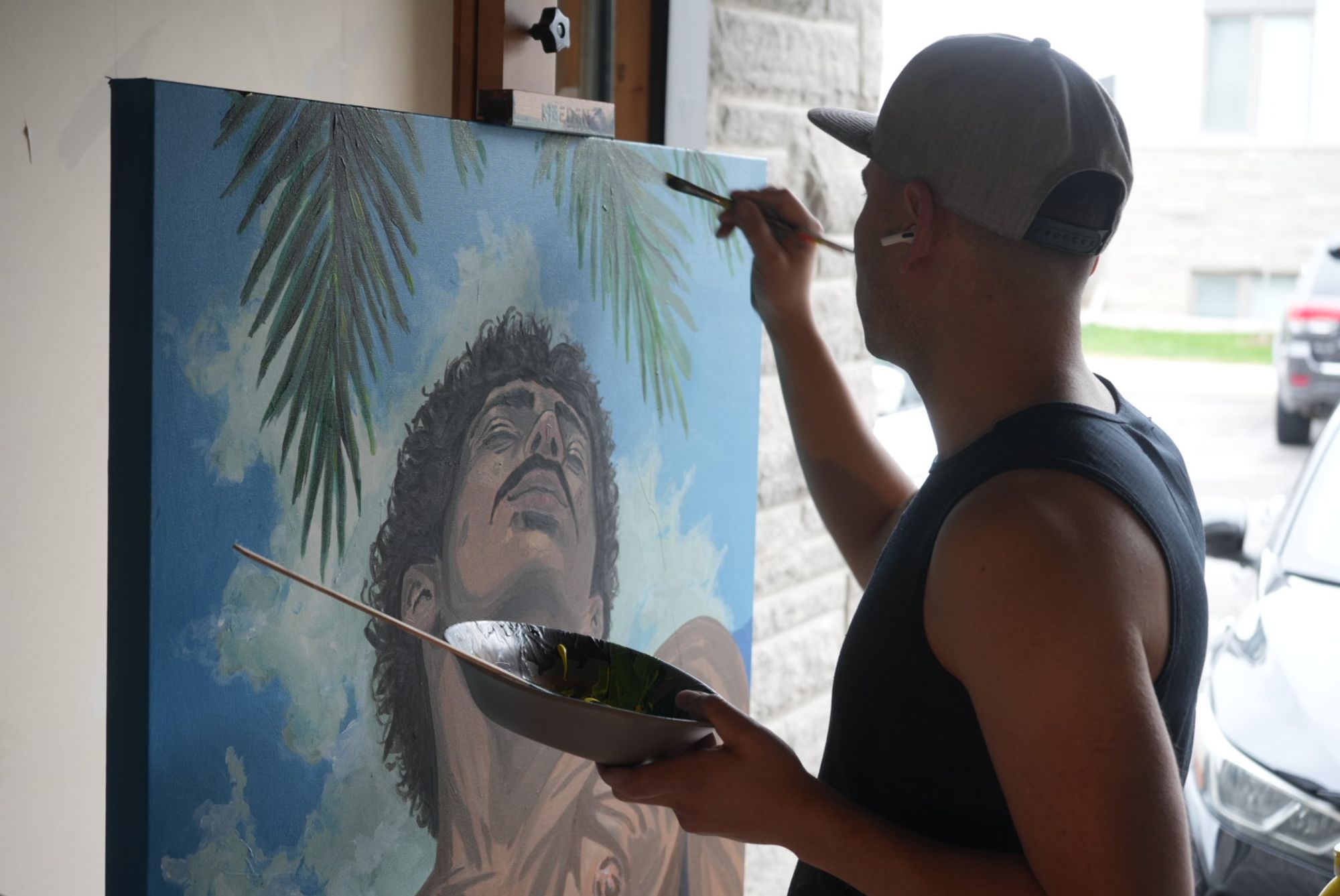 Manuel Murillo painting in his studio in Orleans