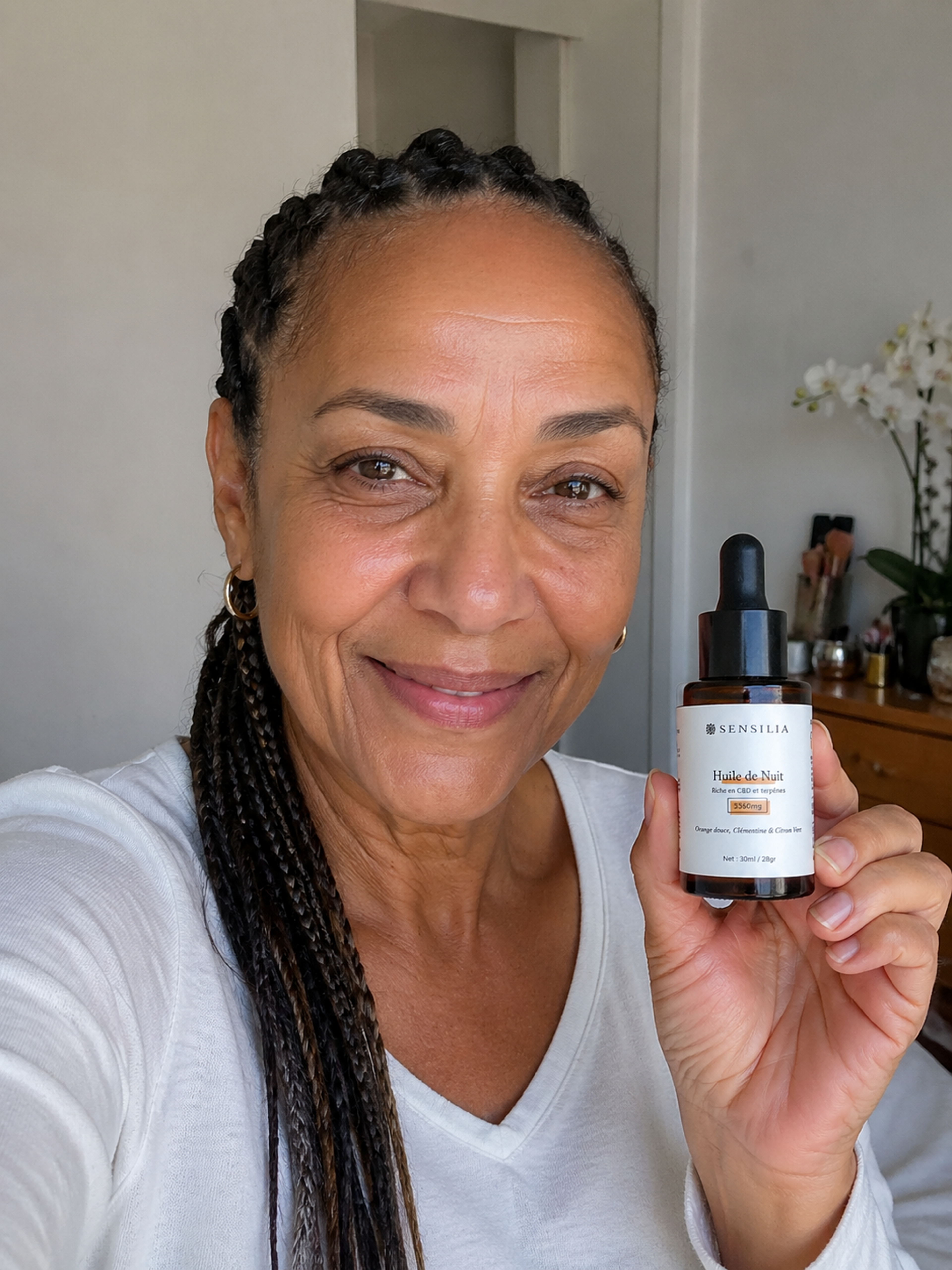 une femme qui utilise l'huile cbd sensilia pour le stress
