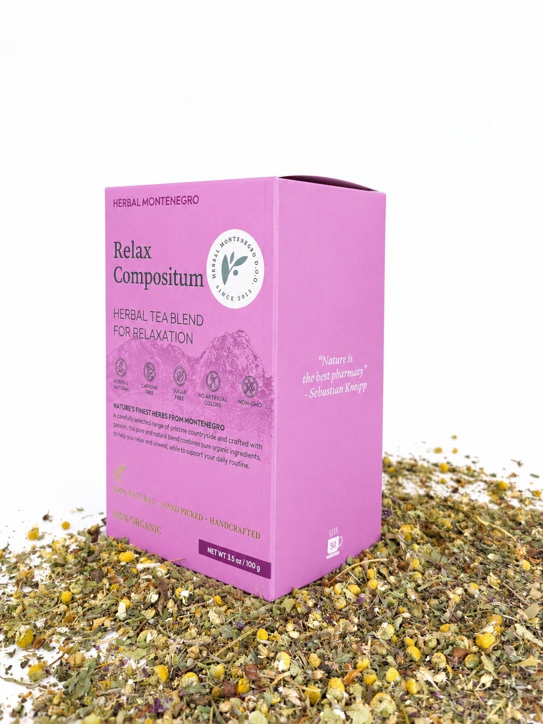 A pink box of Herbal Montenegro Relax Compositum herbal tea surrounded by dried herbs against a white background.