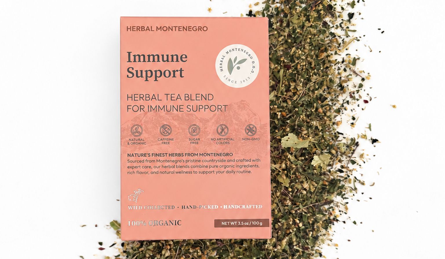 Herbal Montenegro Immune Support herbal tea box placed on a blend of dried medicinal herbs.