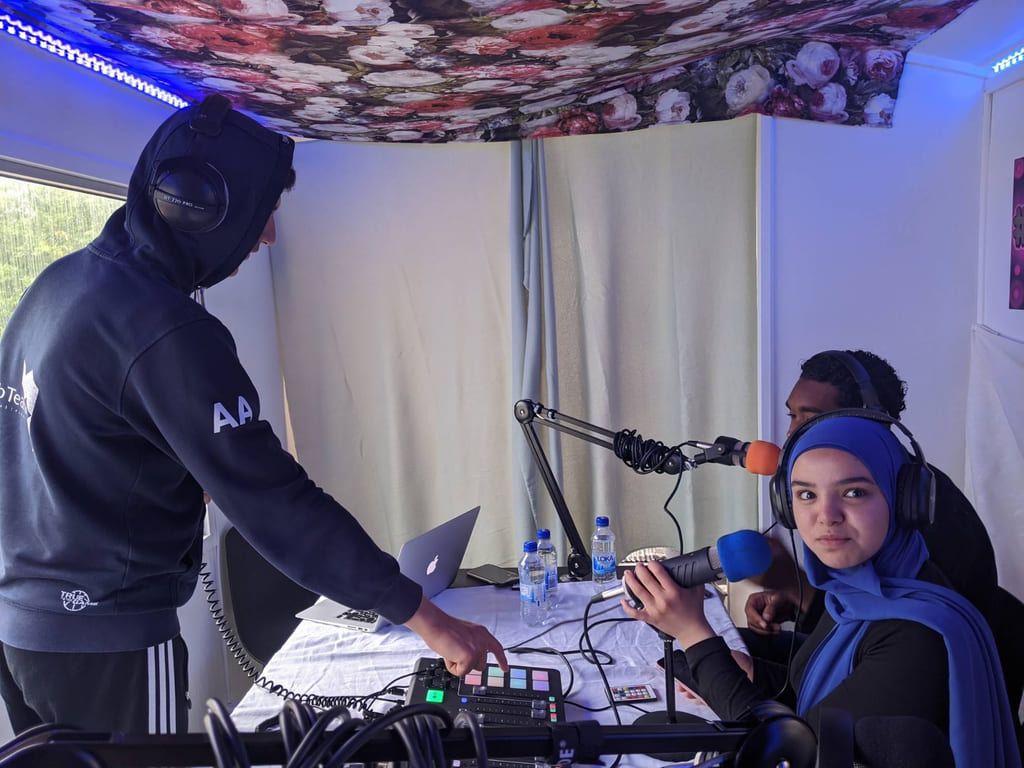 Three young people recording a podcast at the Framtidsverkstaden in Uppsala.