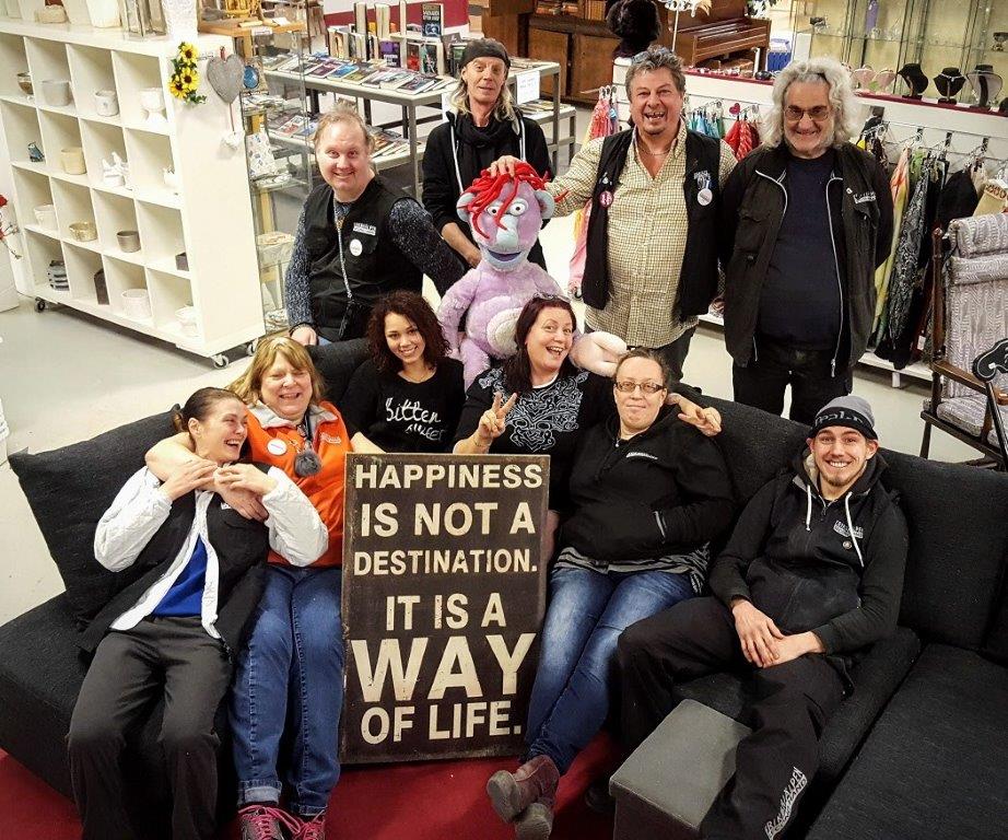Group photo of volunteers and staff inside Erikshjälpen’s shop in Helsingborg.
