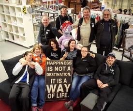 Group photo of volunteers and staff inside Erikshjälpen’s shop in Helsingborg.