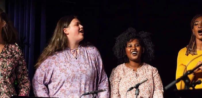 A female choir performing on stage during Bergen International Festival
