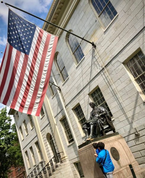The bronze statue of John Harvard at Harvard University in Boston.