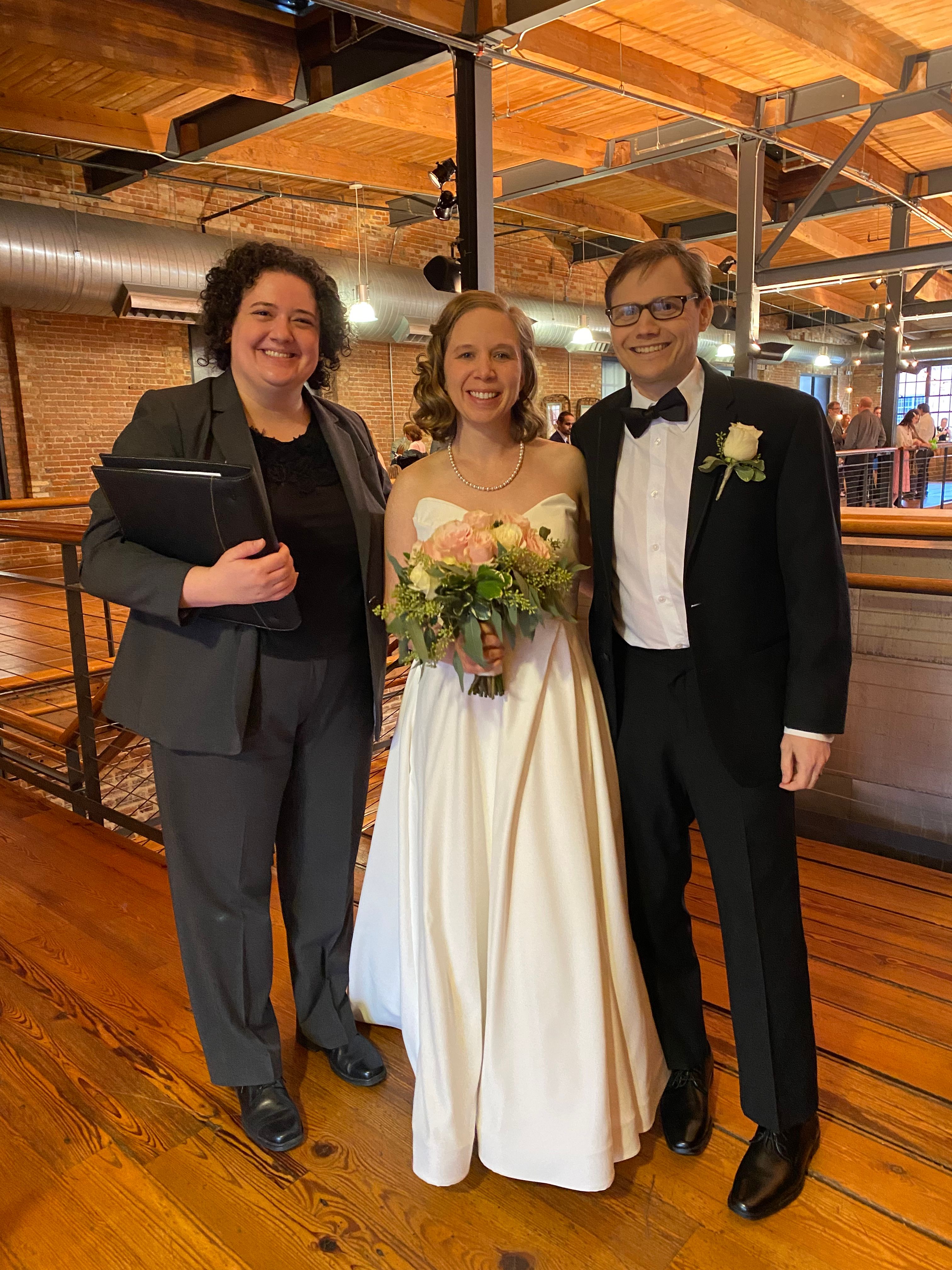 Carly, Diana, and Joel stand smiling 