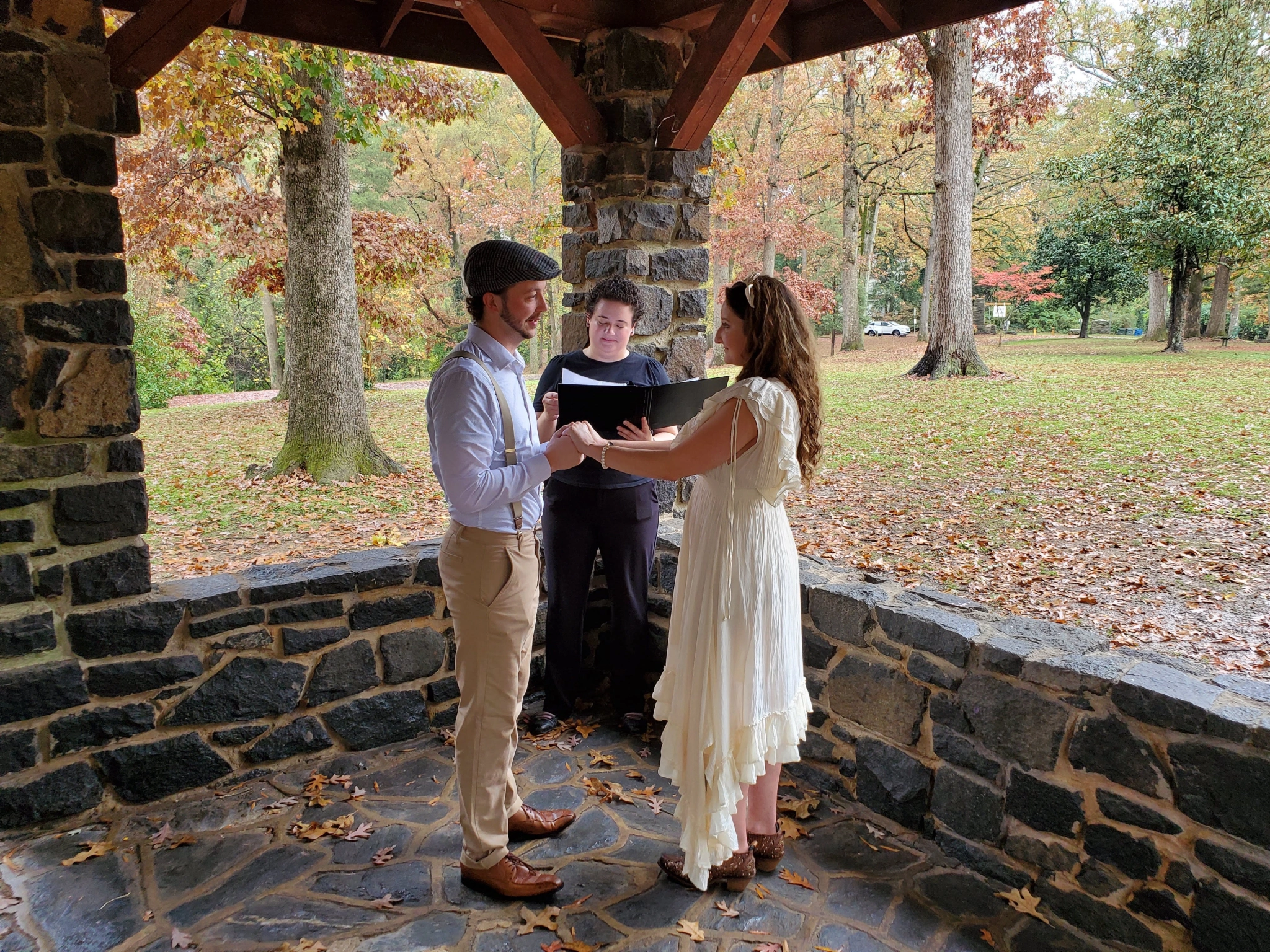 Carly marrying a couple under a picnic shelter in Duke Park