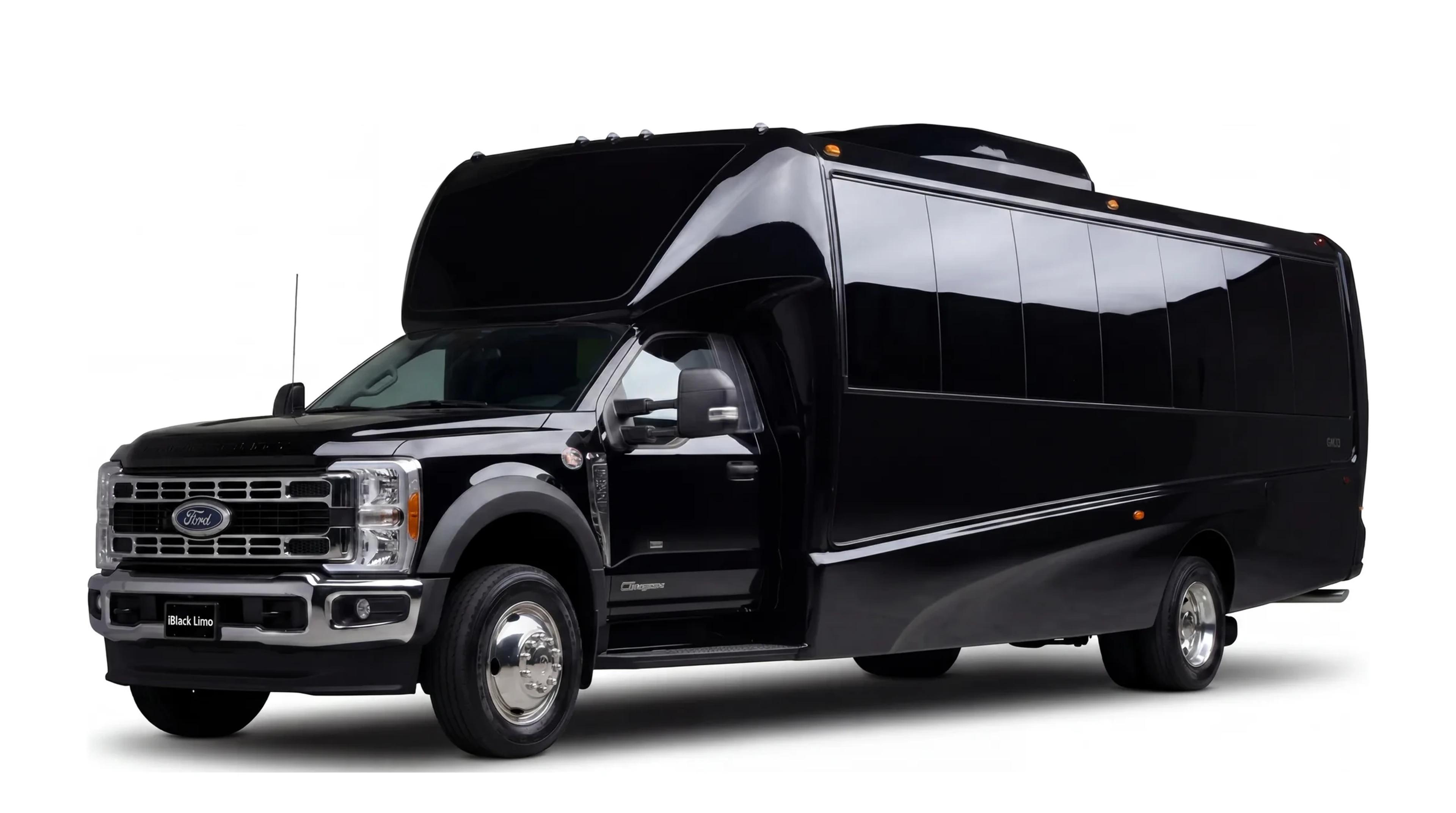 Black luxury mini coach, front three-quarter studio view on white