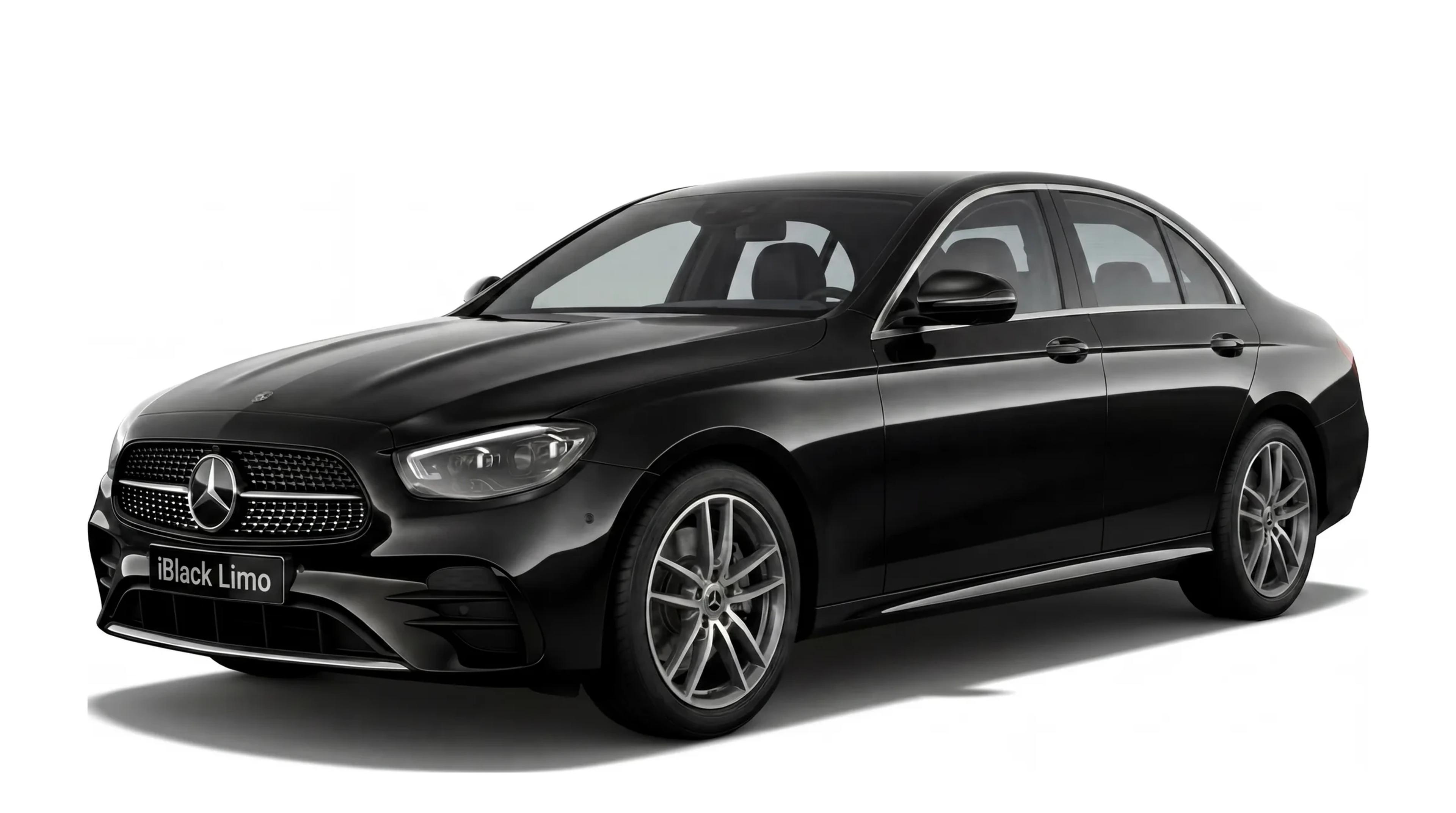 Black Mercedes-Benz E-Class luxury sedan, front three-quarter studio view on white