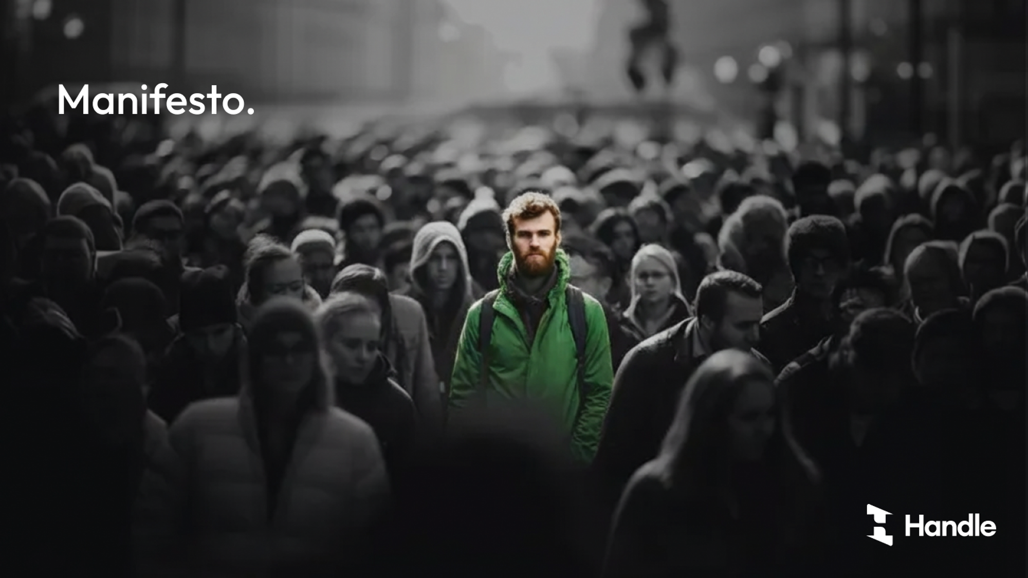 A lone figure in a green jacket standing out in a black and white crowd, under the word Manifesto