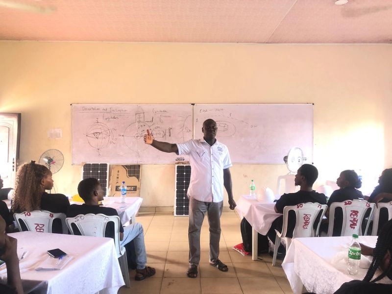 Instructor teaching about Nigeria's latitude and how it influences panel tilt and orientation