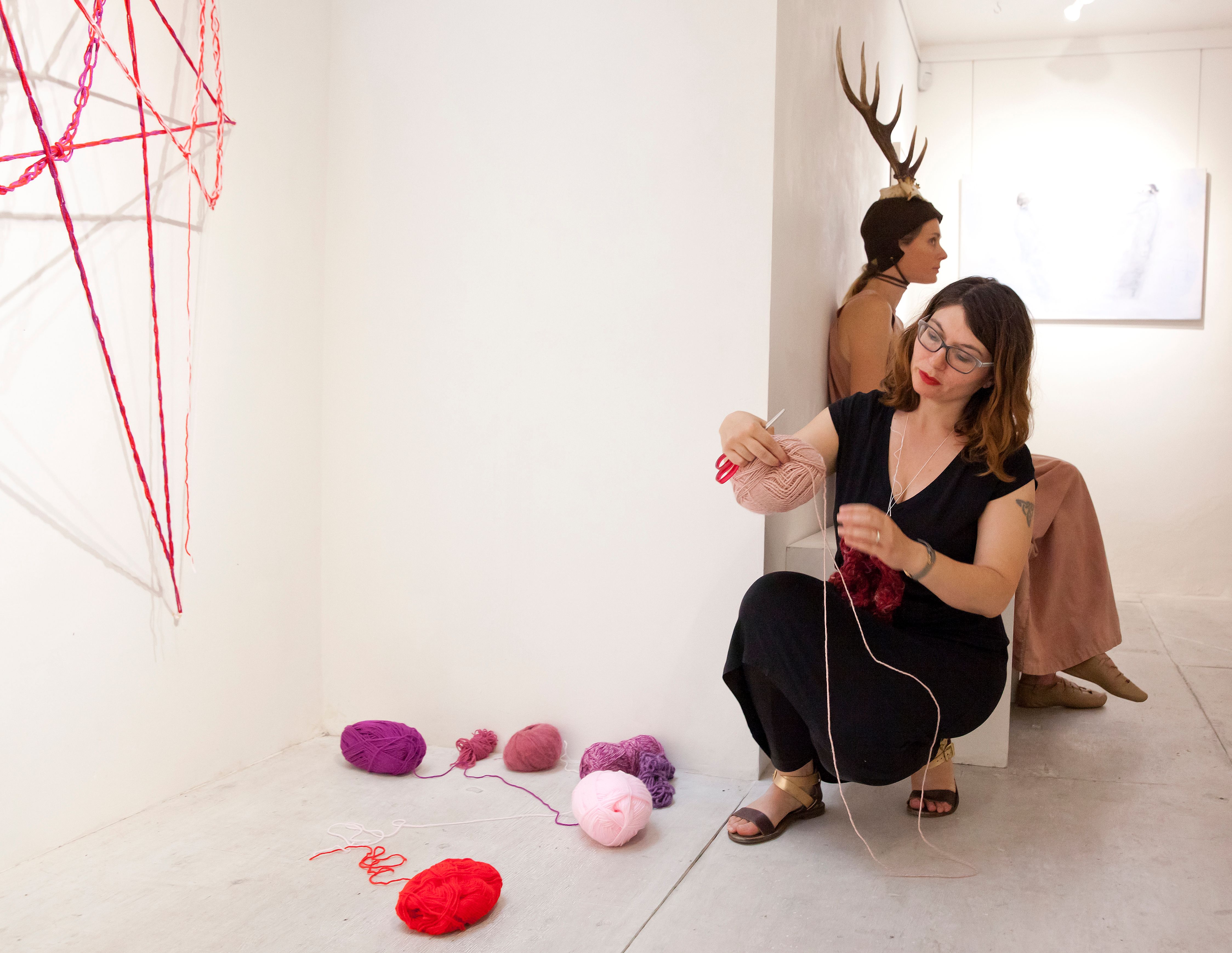 The artist working on her piece Wombweb