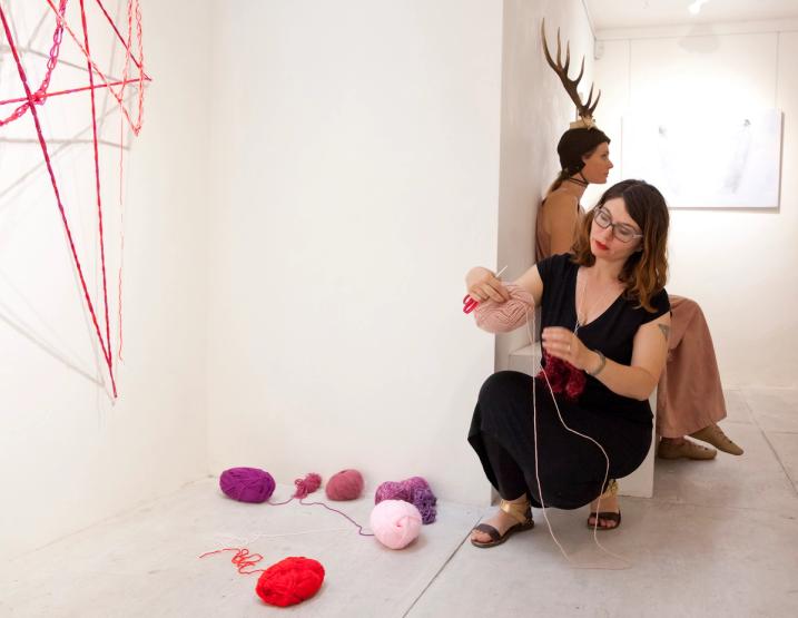 The artist working on her piece Wombweb