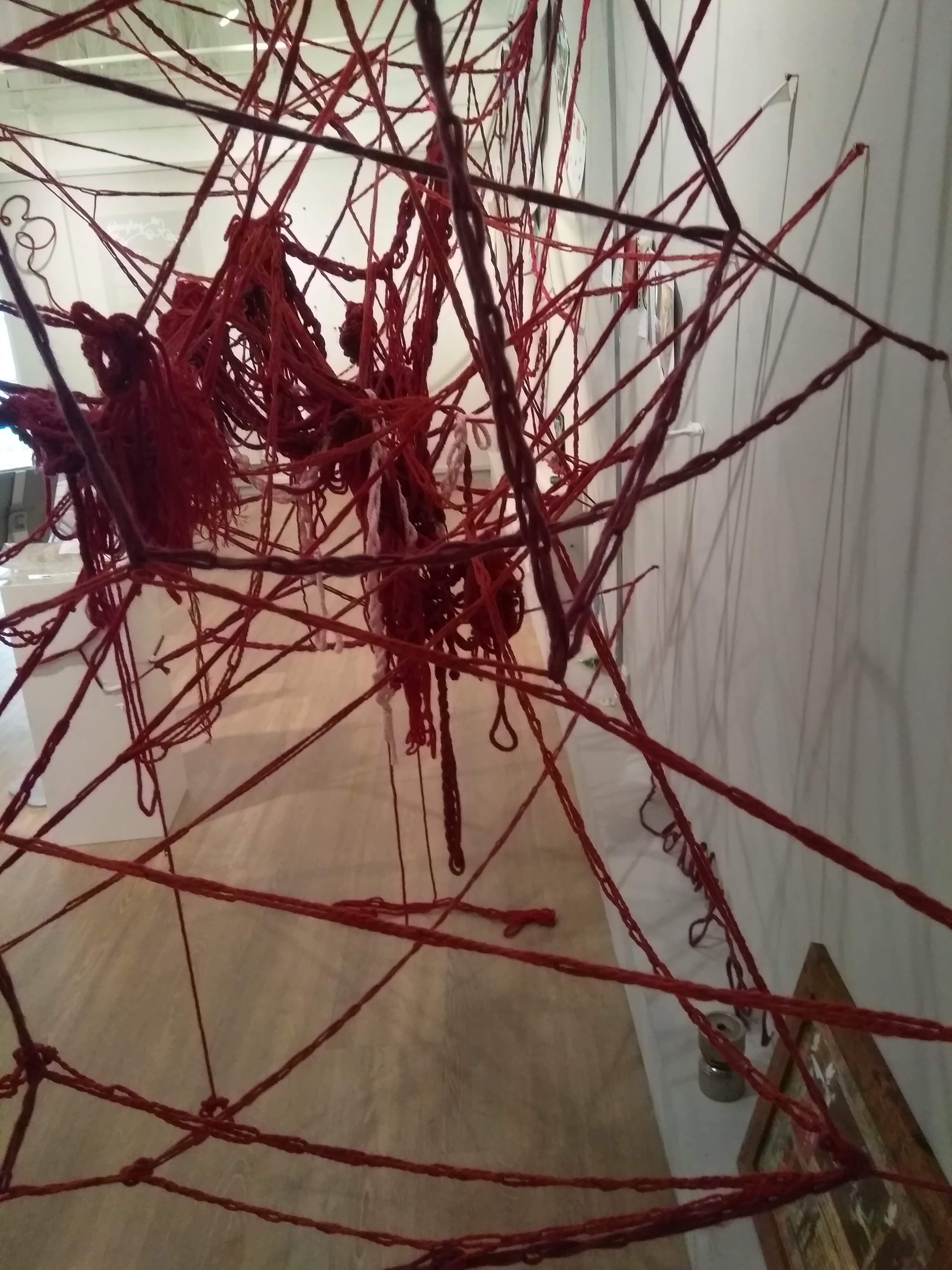 Close up of a Collective Brain showing Red wool tangles and crochet chains