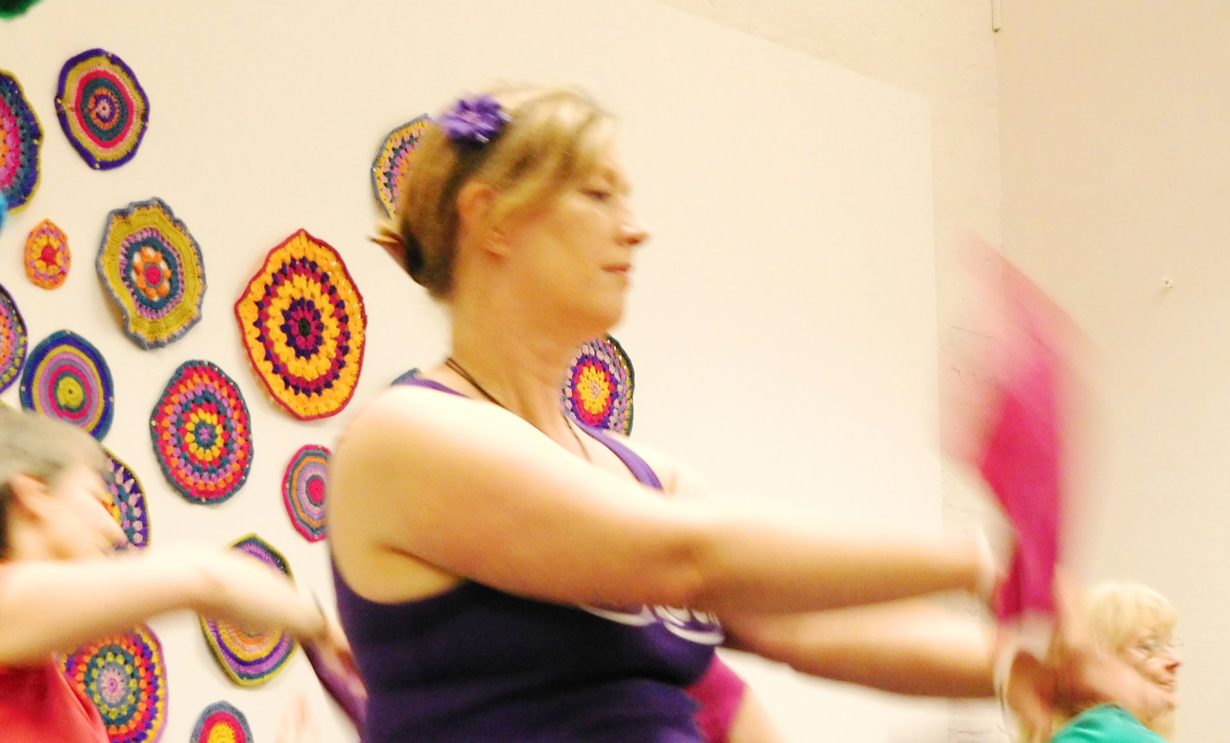 People dancing in response to crochet installation