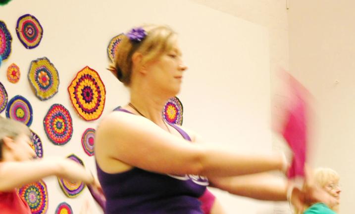 People dancing in response to crochet installation