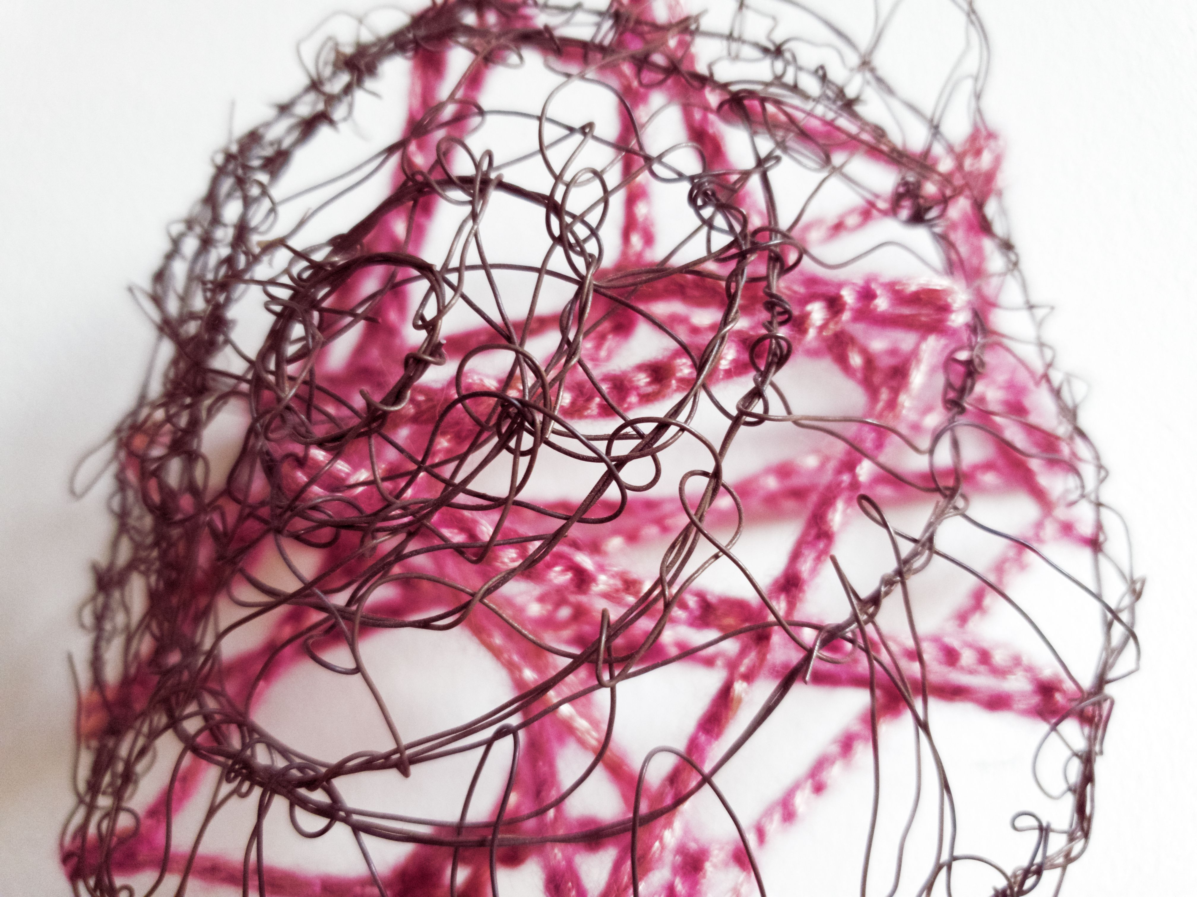 Close up small sculpture with wire and crochet