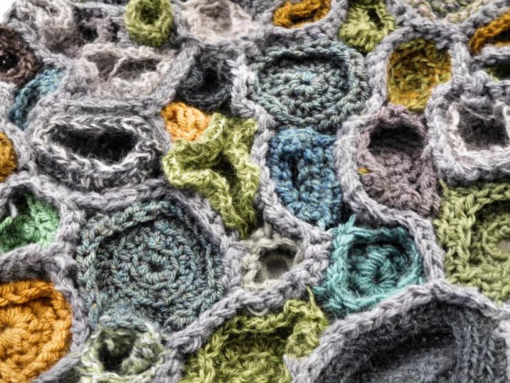 Close up of a crochet sculpture made of lots of semi spherical shapes