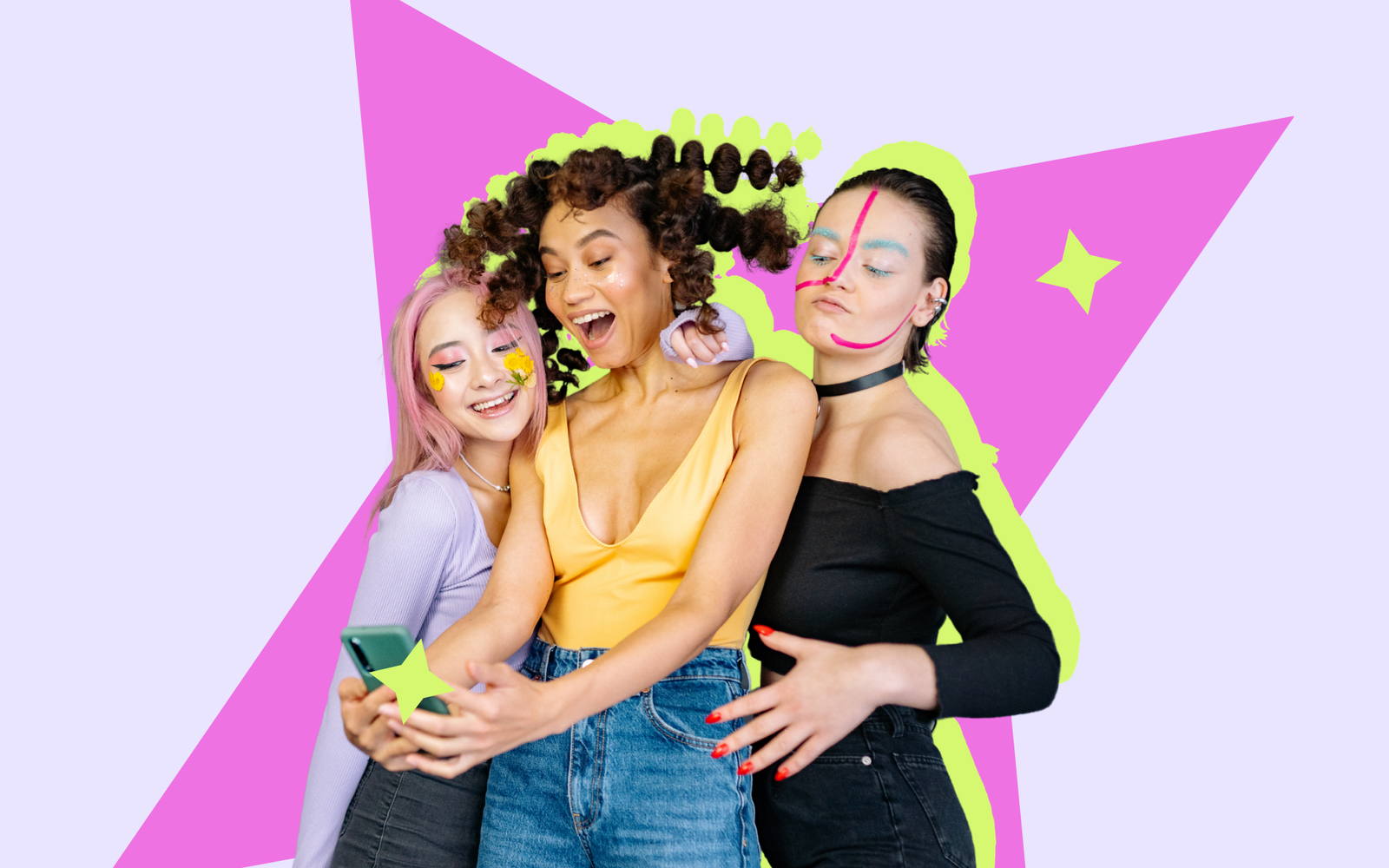 Three young women with colourful makeup taking a selfie together against a bright graphic backdrop.