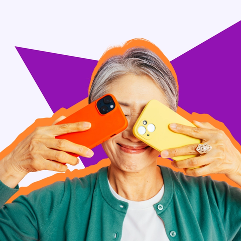 A smiling woman holds an orange and a yellow phone up to her eyes against a purple star graphic