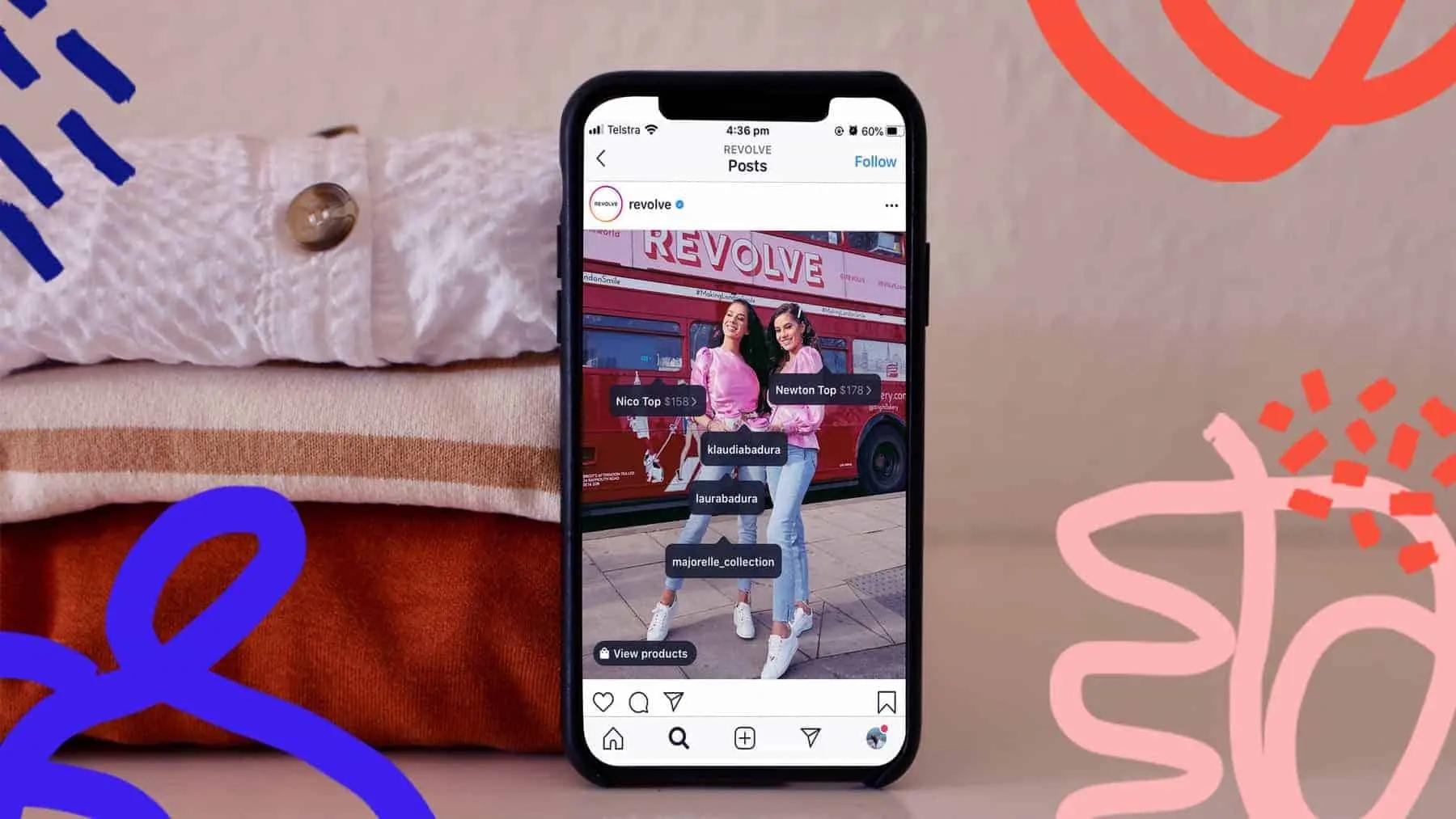 Phone screen showing an Instagram post with tagged product labels over two people posing by a bus