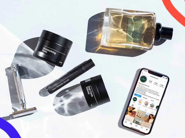 Productos de cuidado de la piel junto a un telefono con el perfil de Instagram de una marca