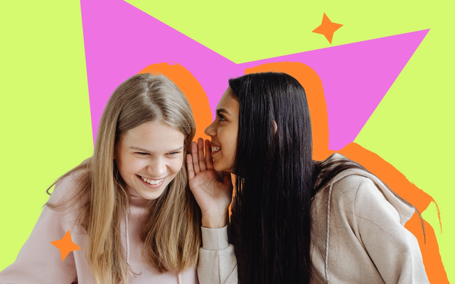 Two young women in pastel hoodies, one leaning in to whisper to the other against a bright graphic backdrop.