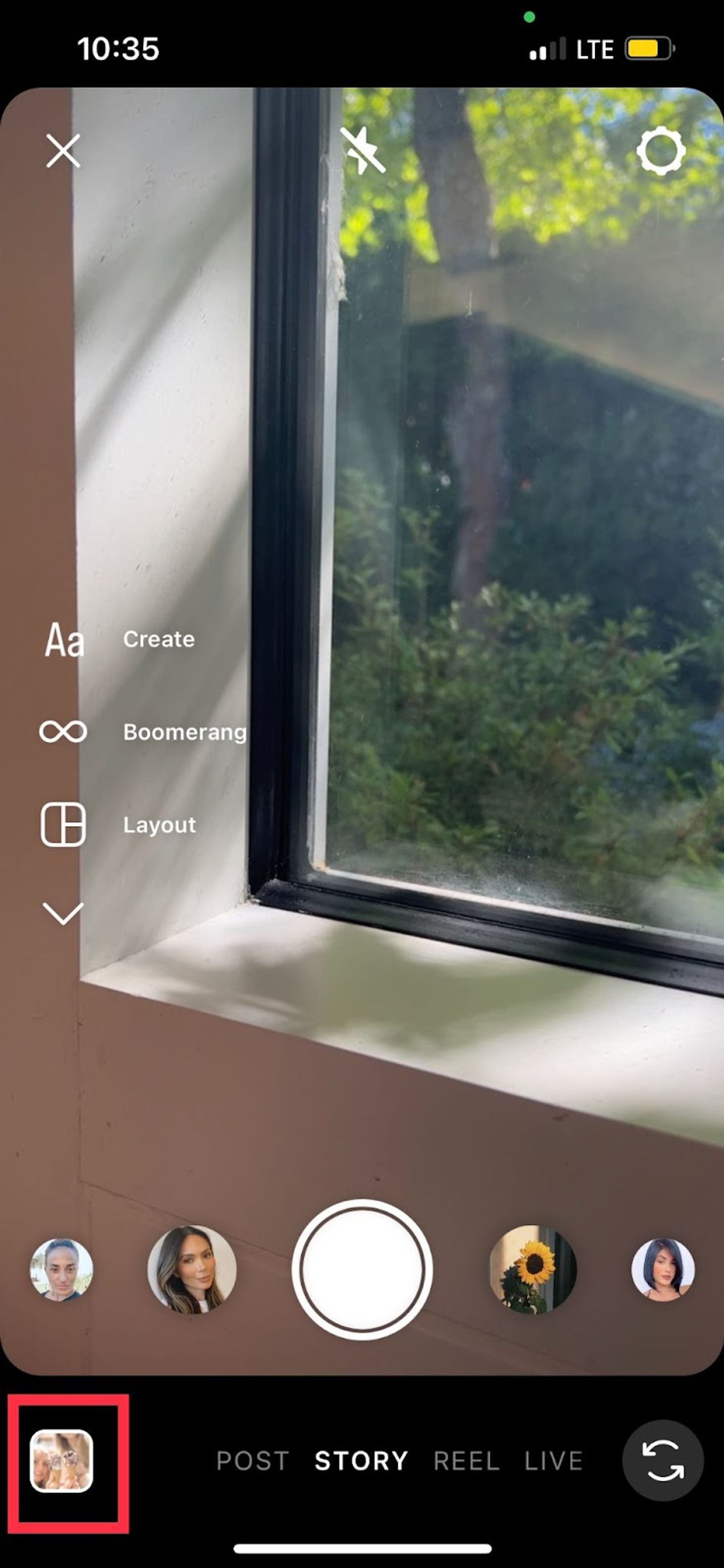 Instagram Story camera screen with a red box highlighting the camera roll upload button, bottom left.