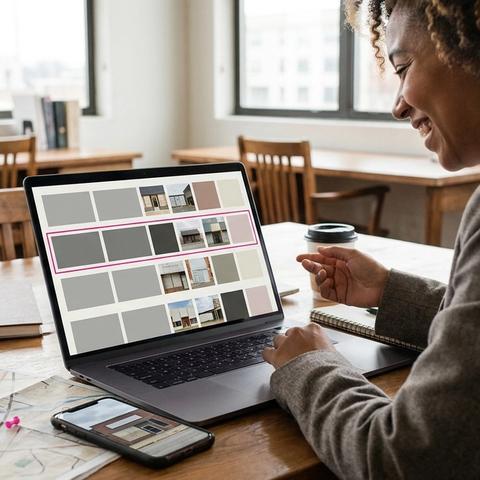 Franchise marketing manager reviewing one content calendar with local posts for several store locations on a laptop