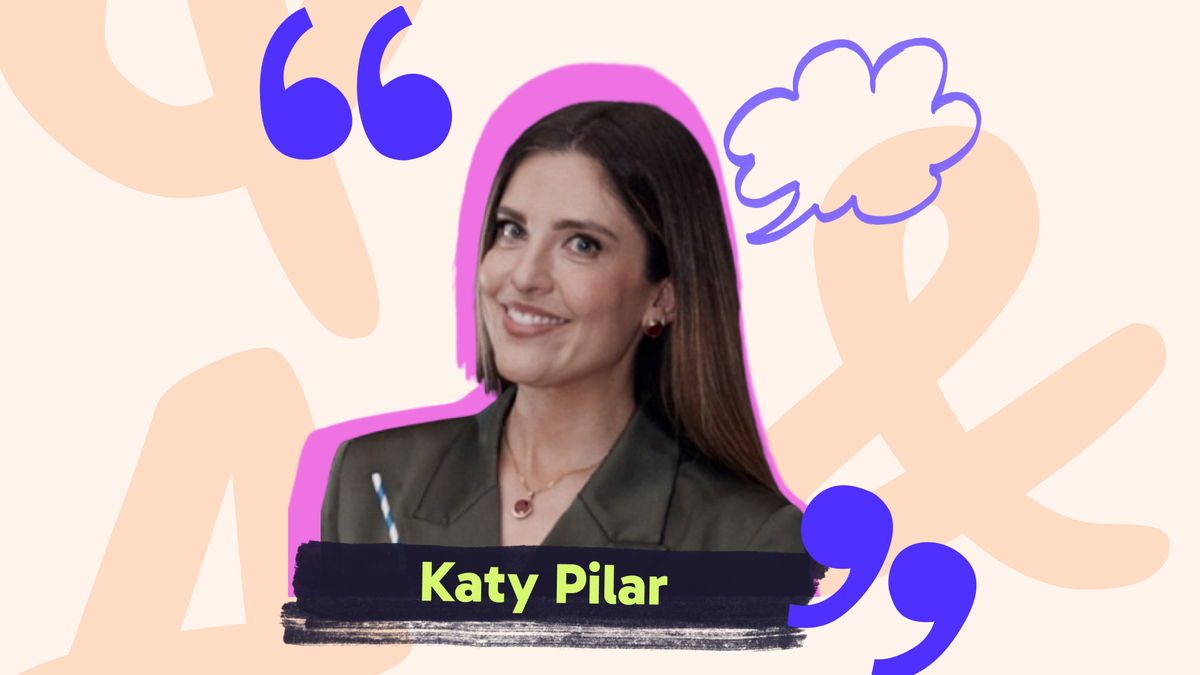 Smiling woman with long brown hair, wearing a green blazer, on a pink and beige abstract background. Text: Katy Pilar.