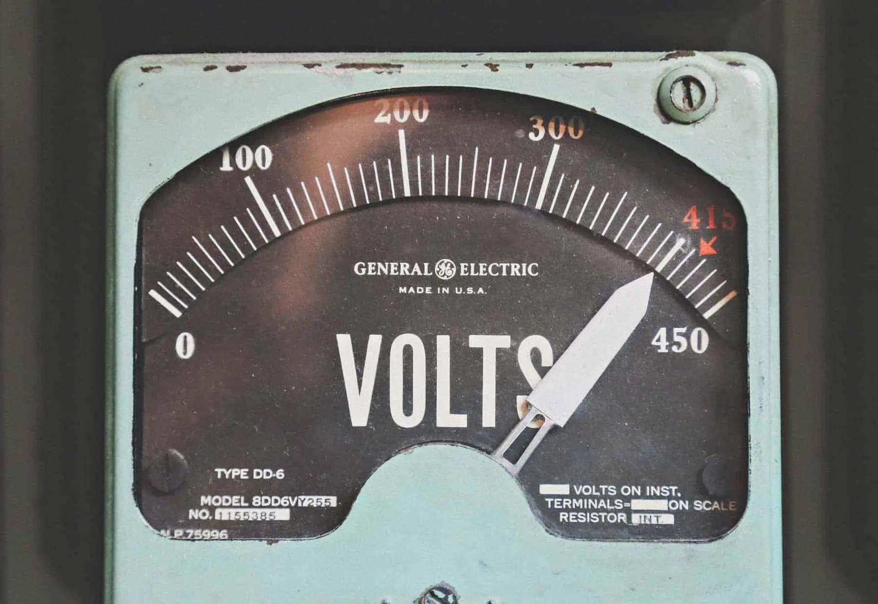 Close-up of a vintage General Electric voltmeter gauge showing a scale from 0 to 450 volts