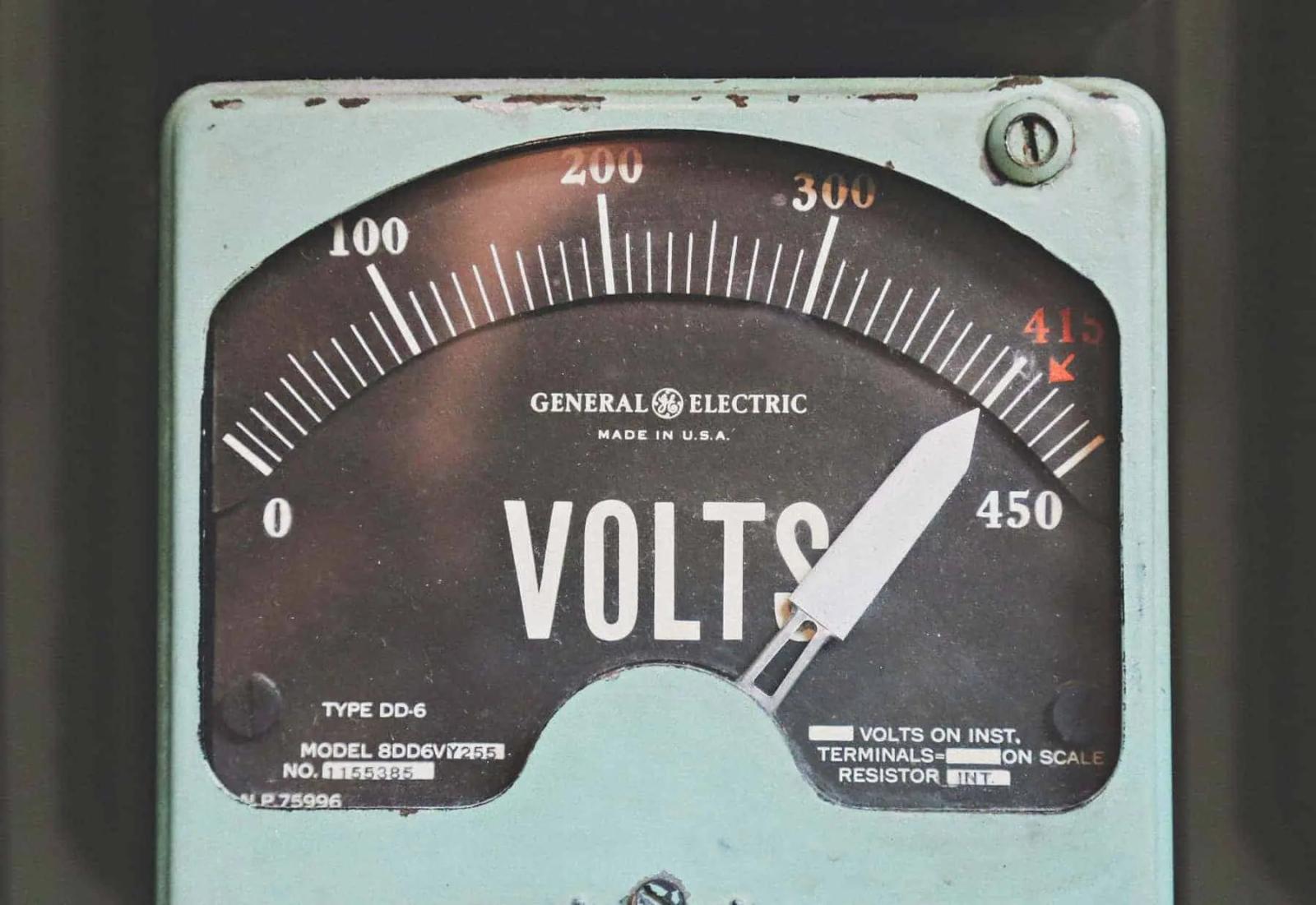 Close-up of a vintage General Electric voltmeter gauge showing a scale from 0 to 450 volts