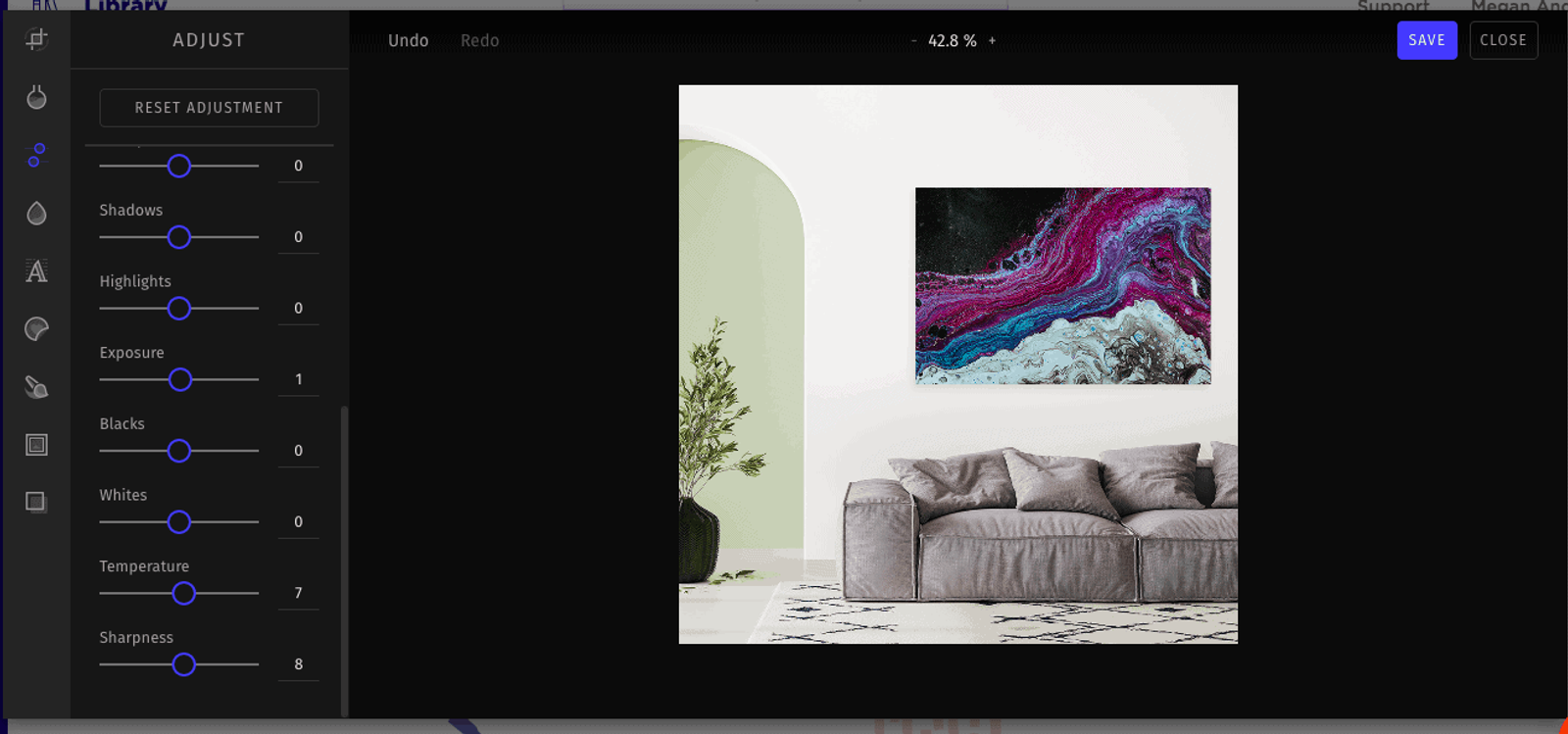 Photo editing interface with adjustment sliders beside a living room image with abstract wall art