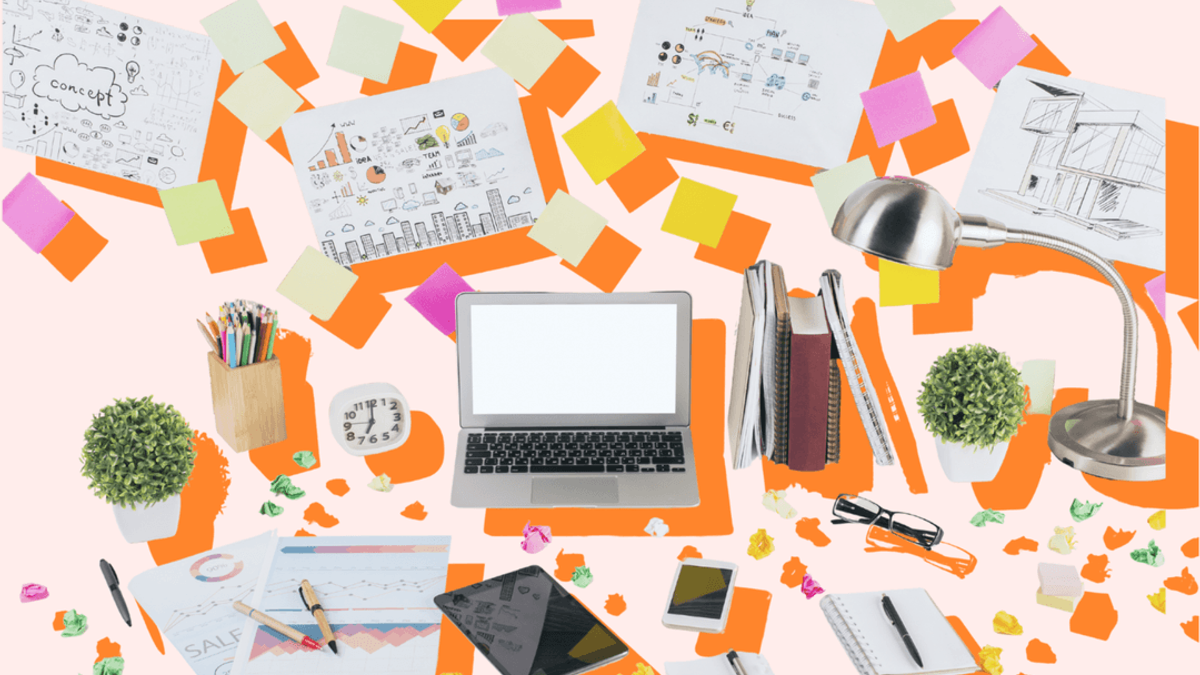 Illustrated desk with laptop, notebooks, charts, sketches and sticky notes scattered around