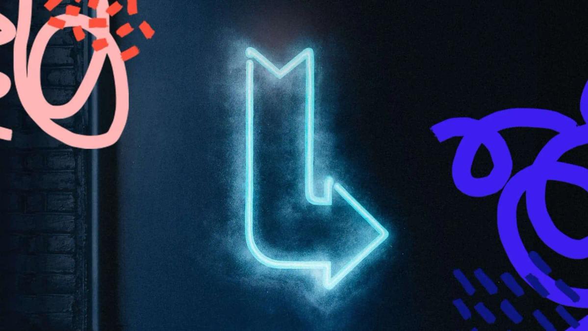 A glowing neon arrow bending downward, framed by pink and blue scribble graphics on a dark wall