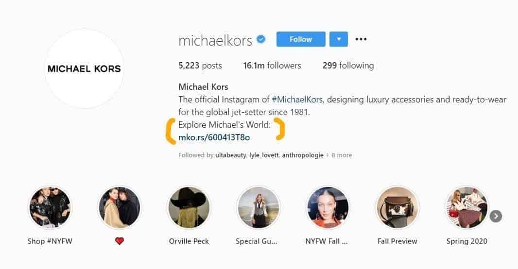 Michael Kors Instagram profile with bio link highlighted and story highlight icons below