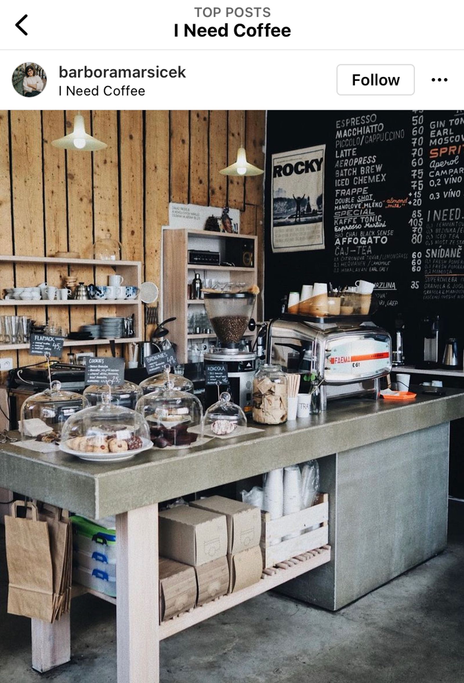 Instagram location page for a coffee shop showing a top post of the counter and menu board.