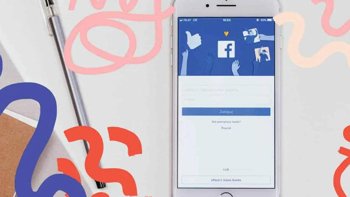 White iPhone displaying Facebook login screen, with blue, red, and pink abstract shapes on a white background. Neutral mood.