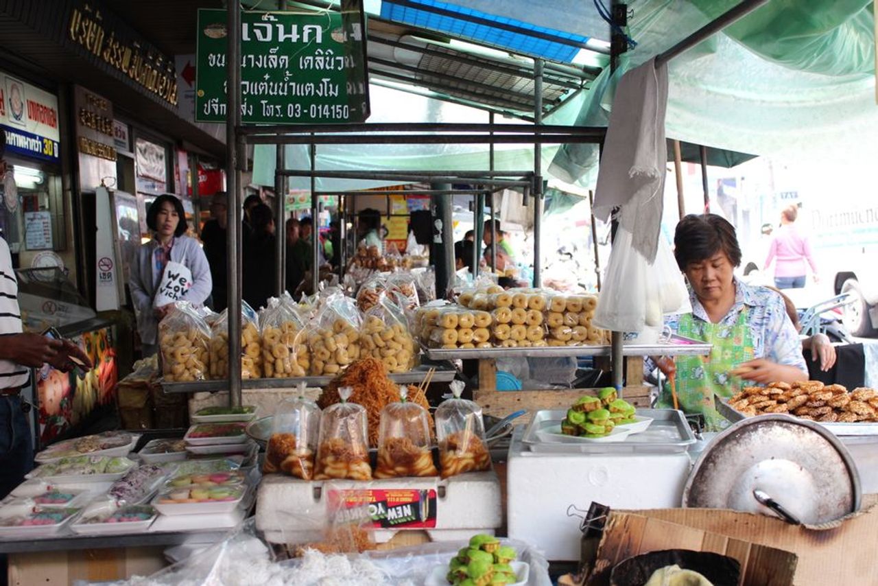 Busy aisle of stalls at Chatuchak Weekend Market in Bangkok