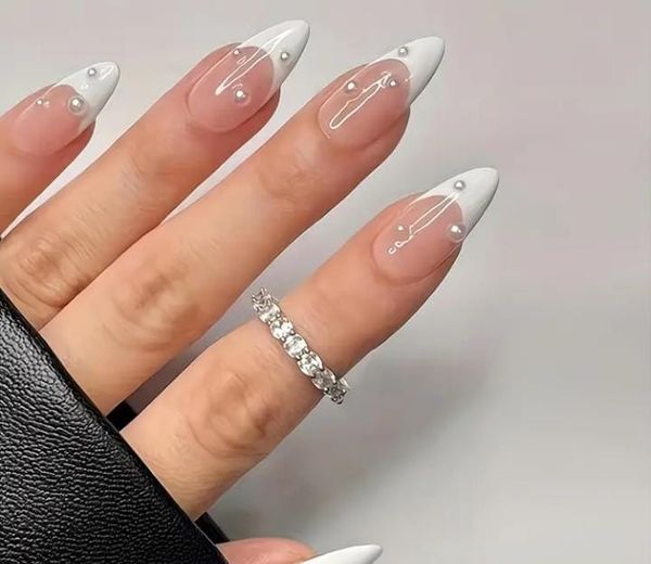Medium-Length White-Edged Pearl Nails.