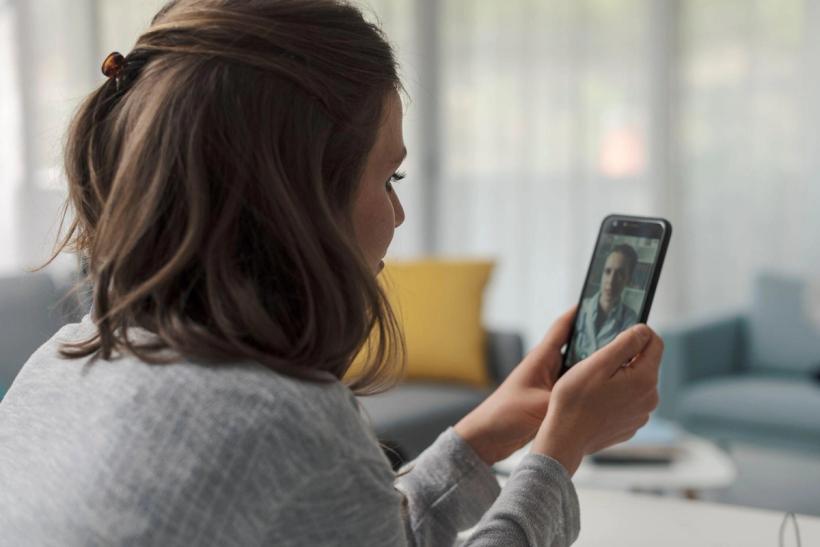 Woman video chatting with a doctor from 24hrdoc
