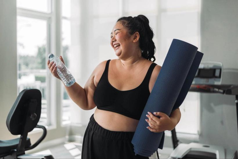A woman at the gym smiling