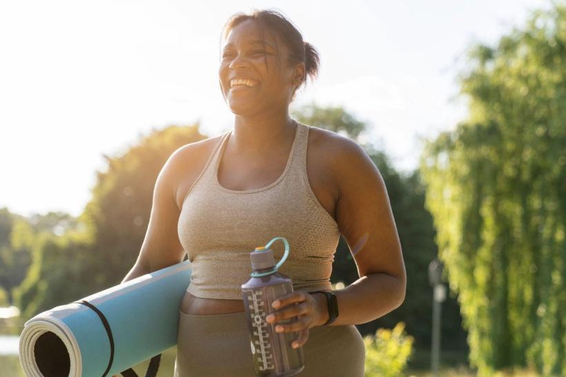 A woman happy that she just finished a workout for weight loss
