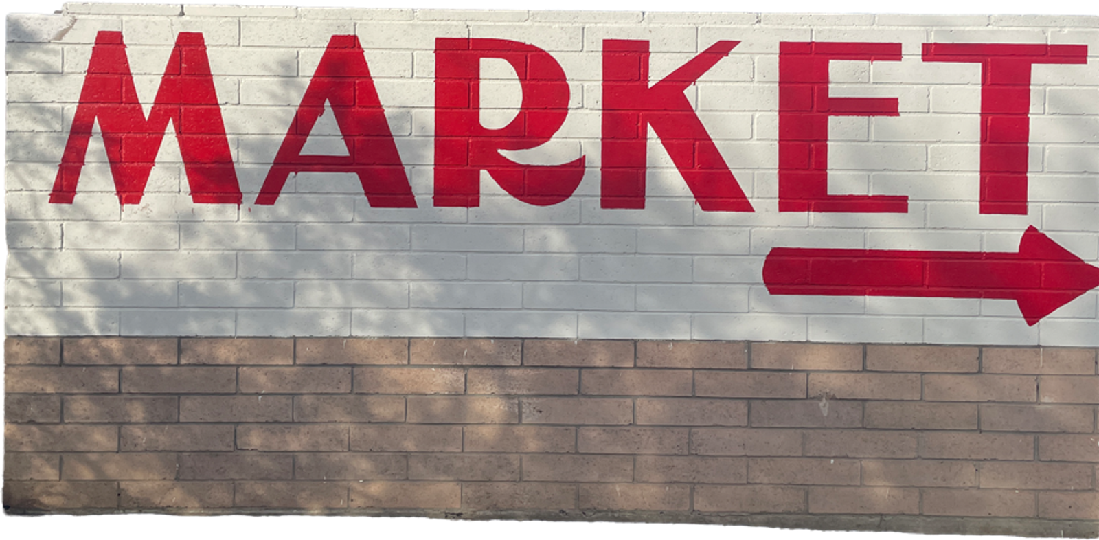 Market sign with arrow
