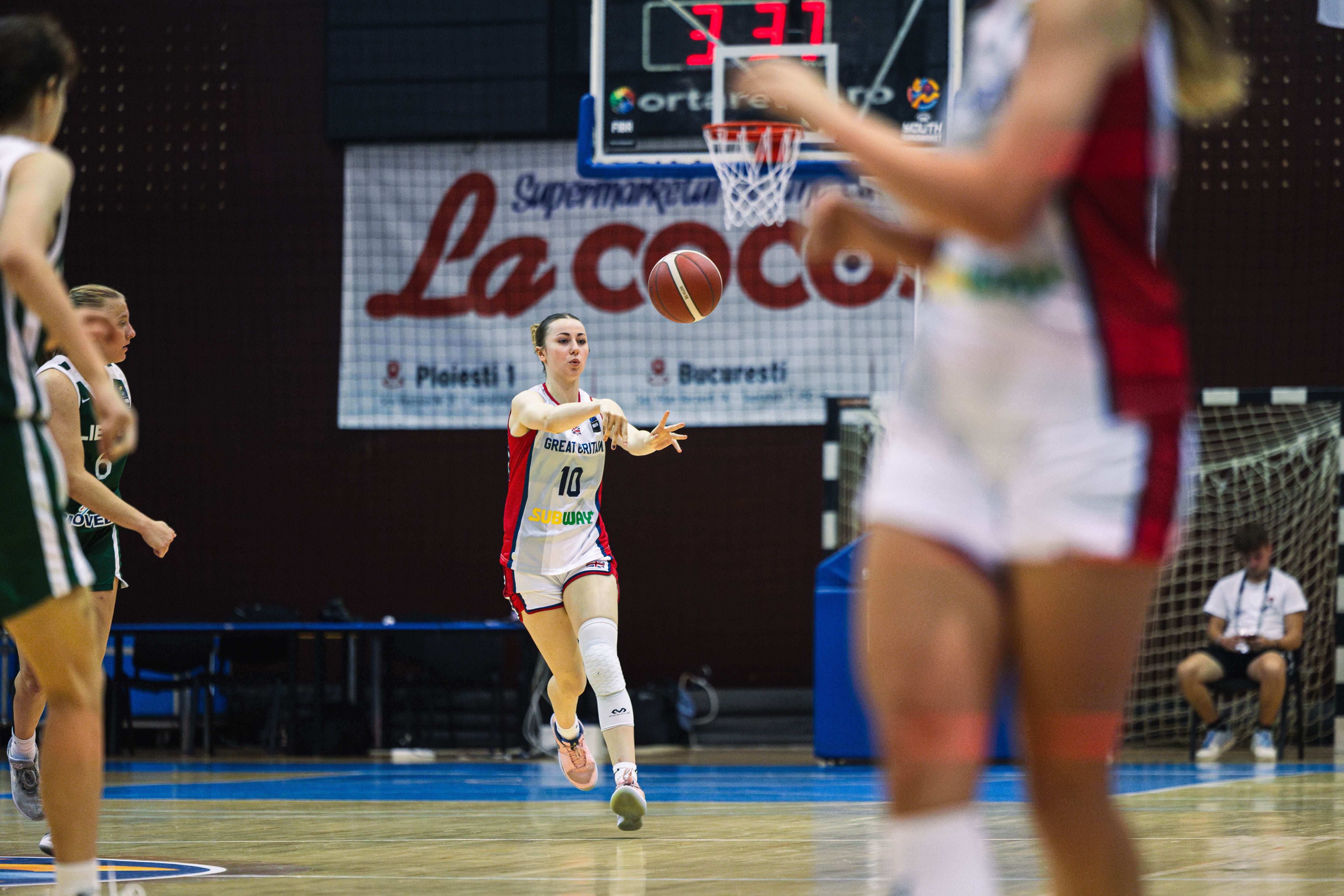 Maisie Keyes passes the ball at EuroBasket 2024