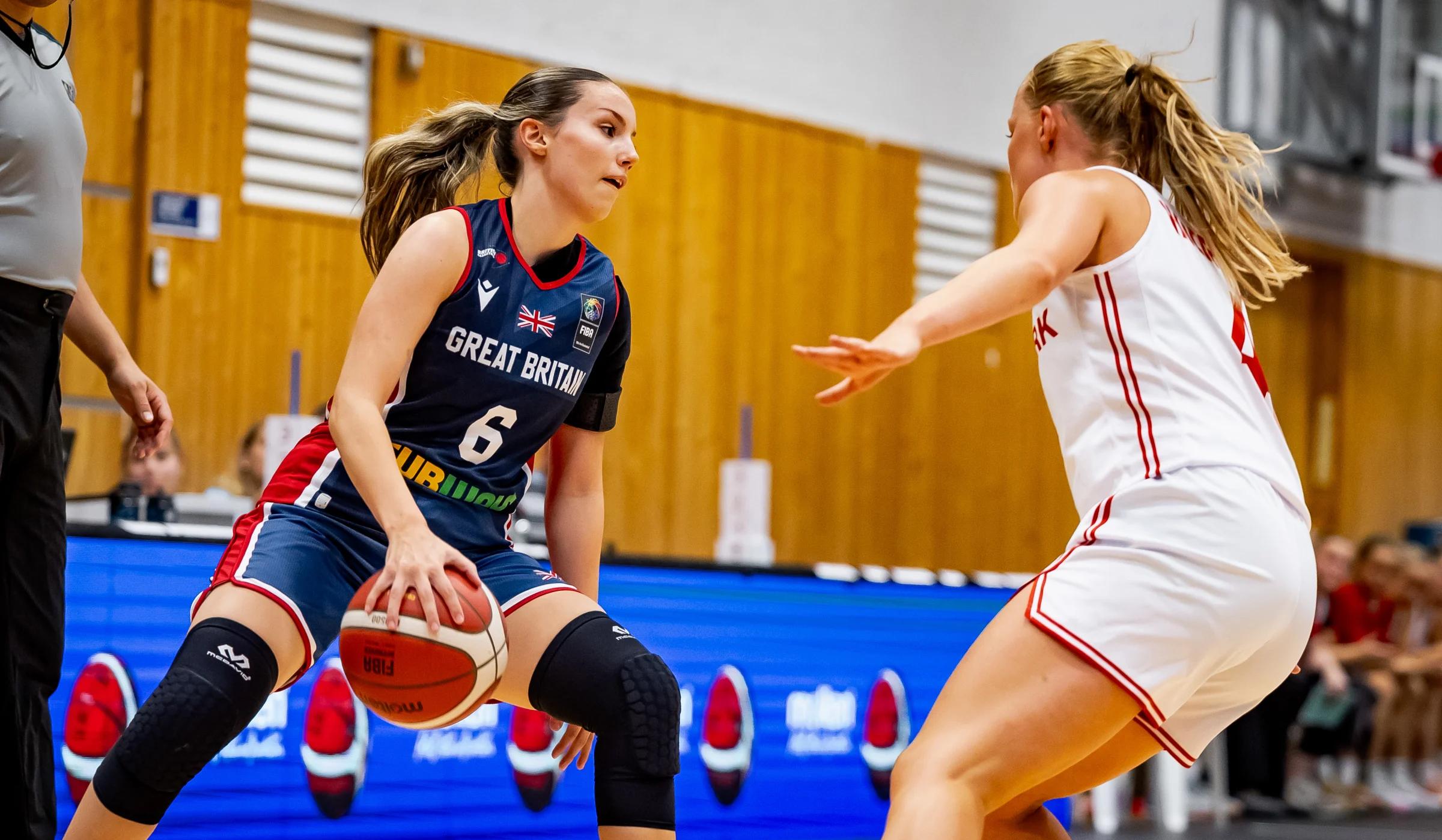 Olivia Forster crosses the ball over in GB's game against Denmark in the U20 Women's EuroBasket