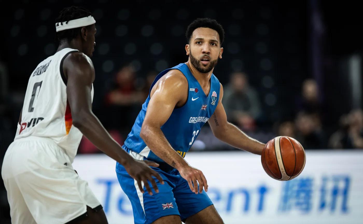 Pat Whelan holds the ball for GB against Germany at EuroBasket 2025