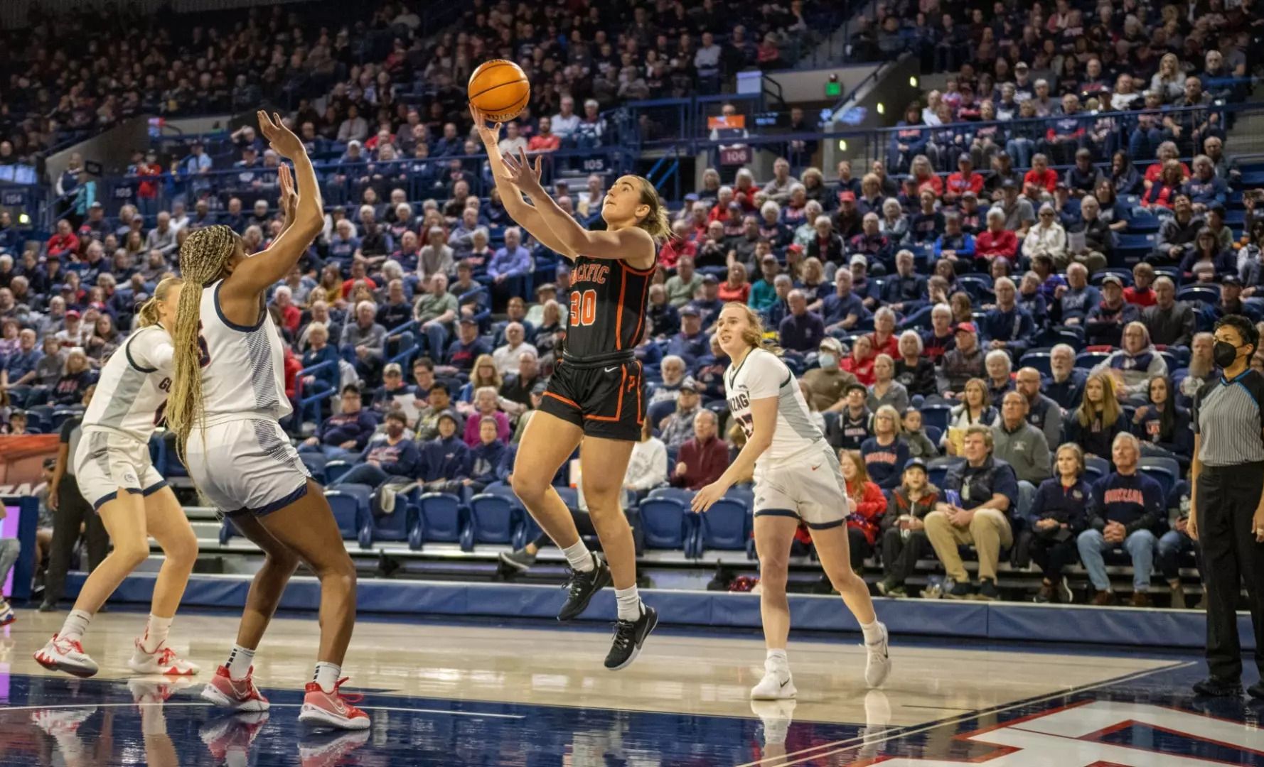 Sam Ashby taking a lay up for Pacific Tigers